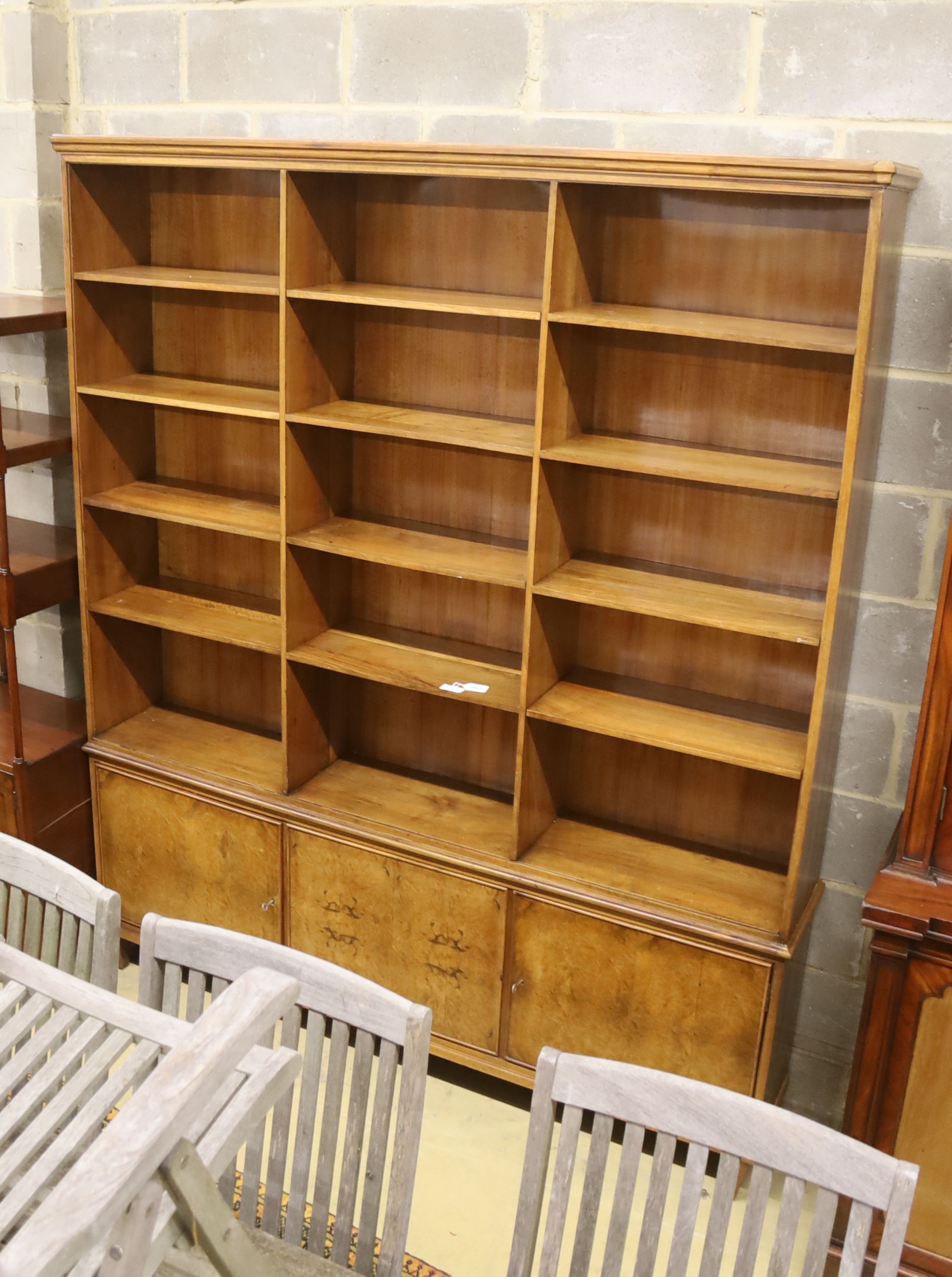 A mid century walnut open bookcase cupboard, length 186cm, depth 30cm, height 220cm